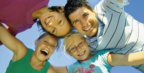 Family smiling at the camera